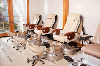 Modern nail salon with manicure and pedicure stations.
